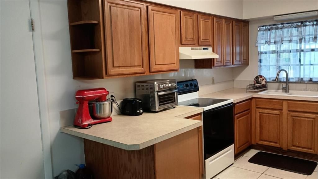 Kitchen has plenty of space and includes all appliances.