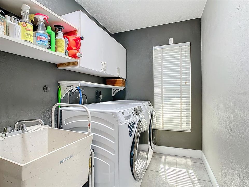 Laundry room is located off the kitchen and offers access to the garage