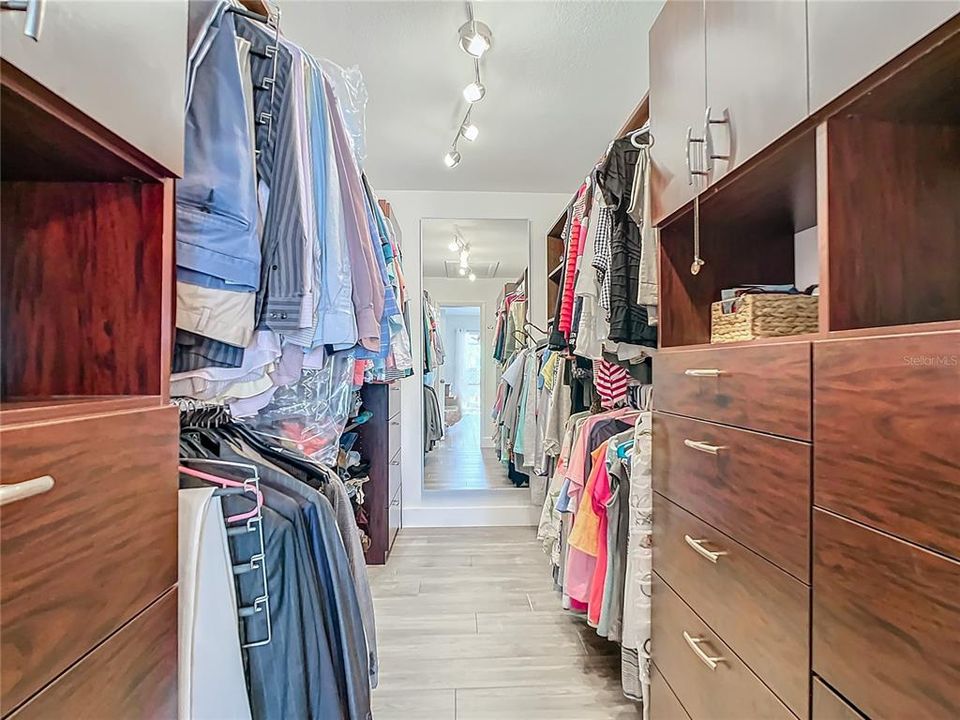 Enormous walk in closet updated with California closet fixtures