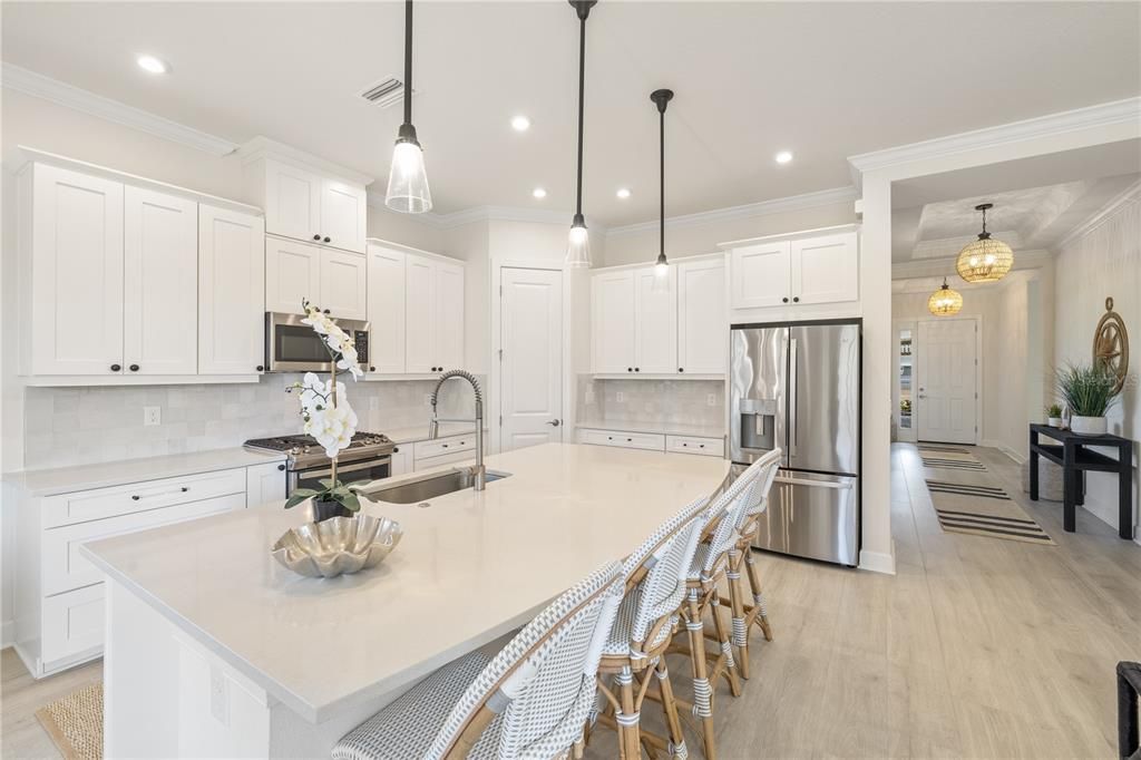 The chef’s kitchen showcases quartz countertops.