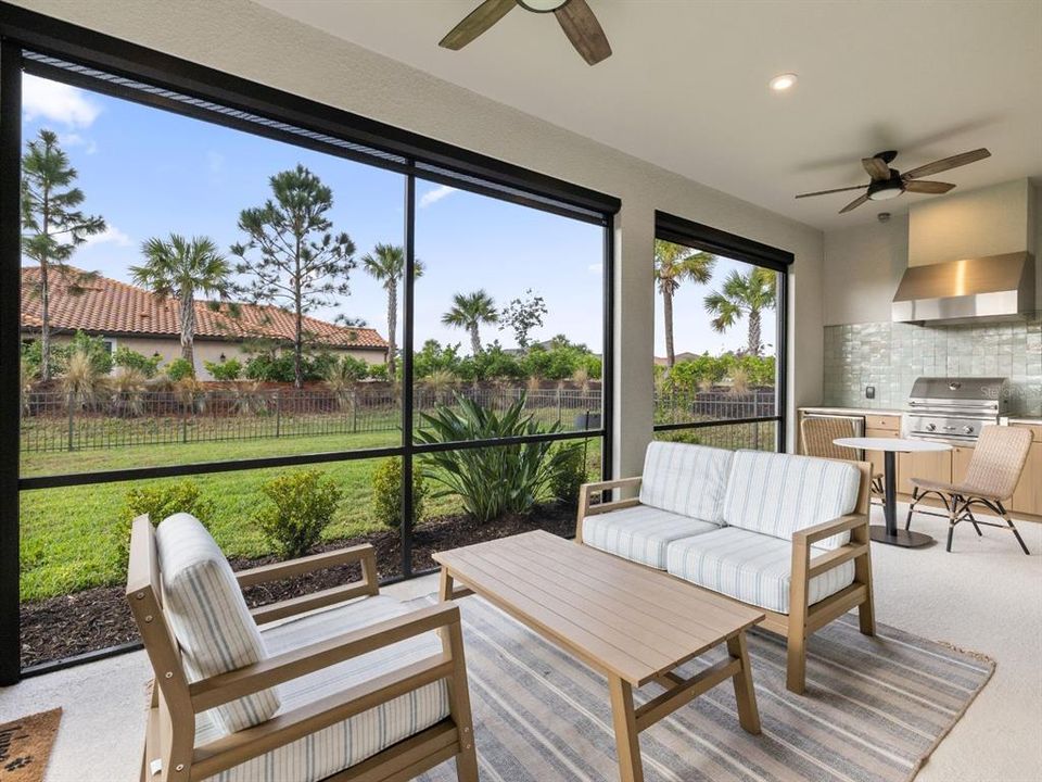 Outside patio featuring a fully equipped kitchen with upgraded marble.