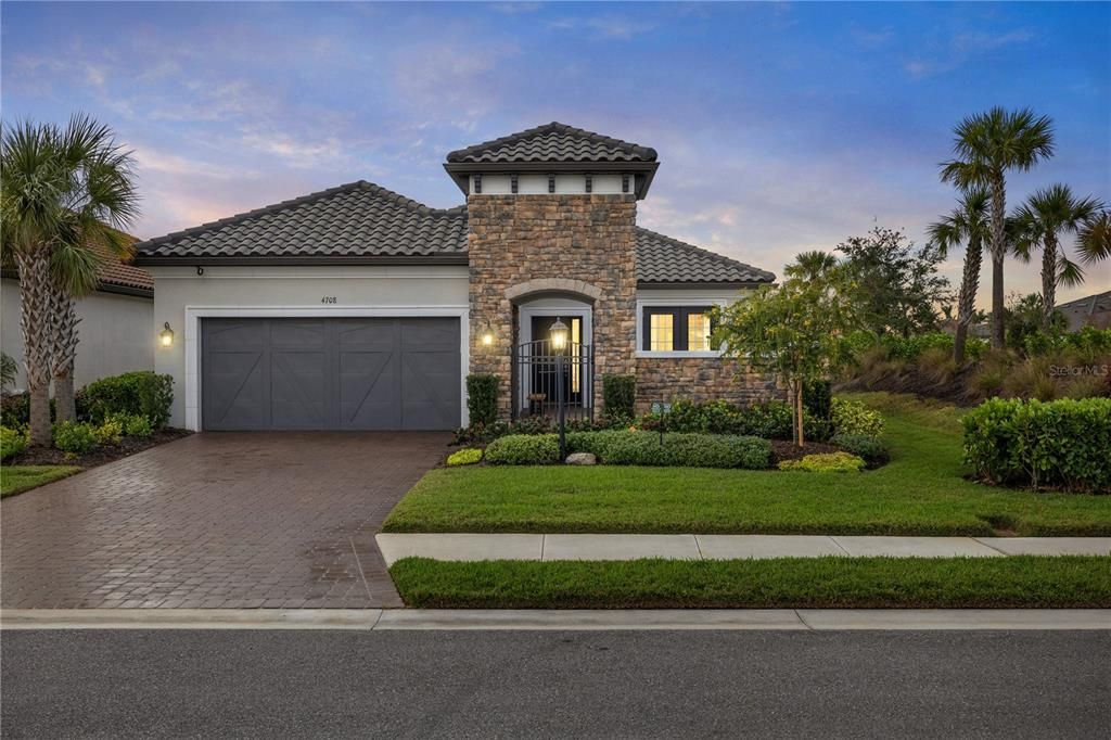 Front view of home featuring beautiful stone work.