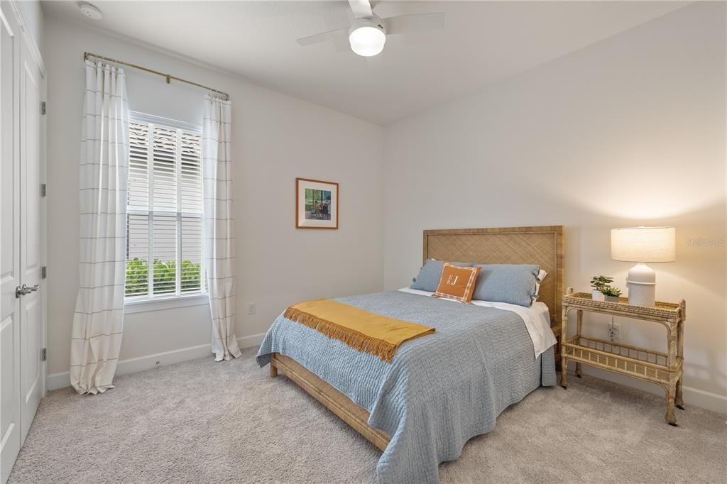 Bedroom 2 showcasing an abundance of natural lighting.