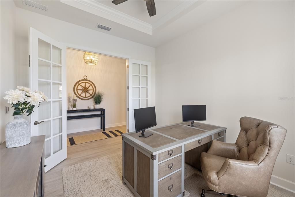 Currently being used as a den, this room offers amazing lighting and French doors off of the entry way hallway.