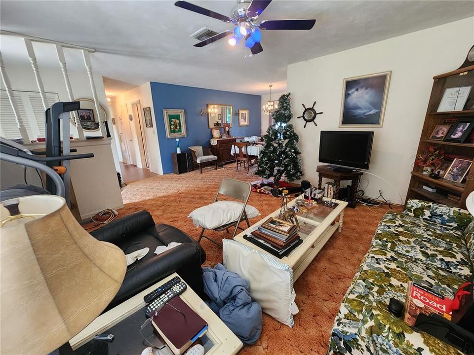 Front living area towards bedrooms and dining area.