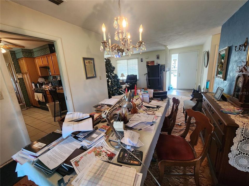 Dining room. Kitchen at left, front living room afar.