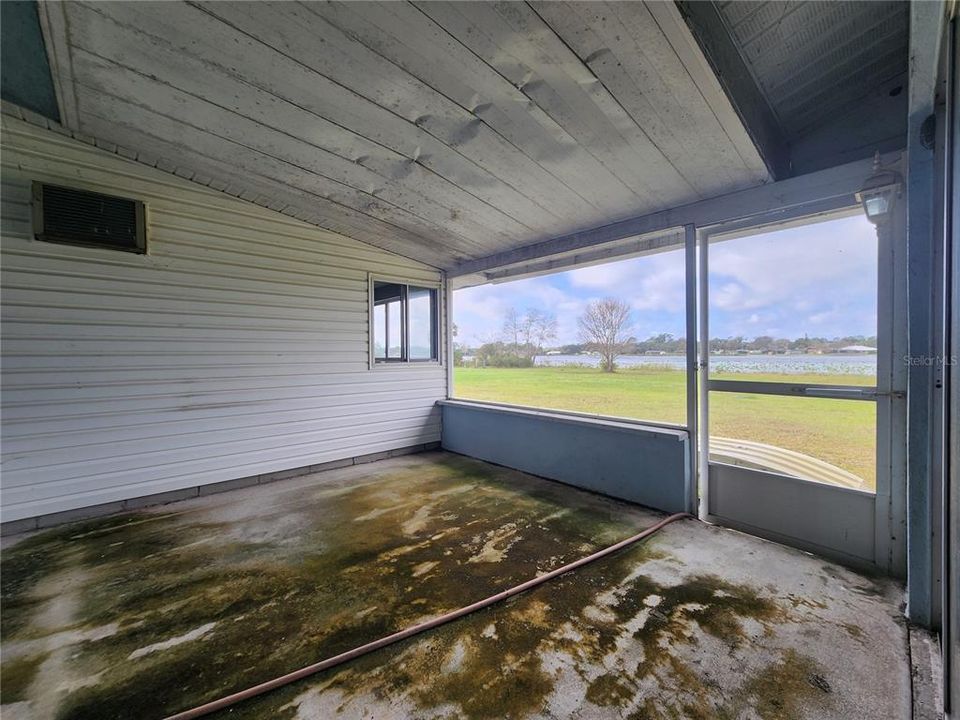 Screened patio adjacent to rear family room.