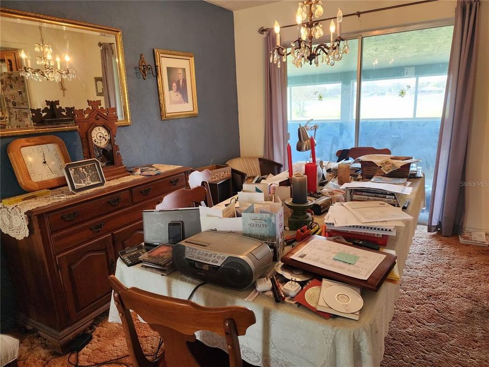 Dining area towards middle screened porch.