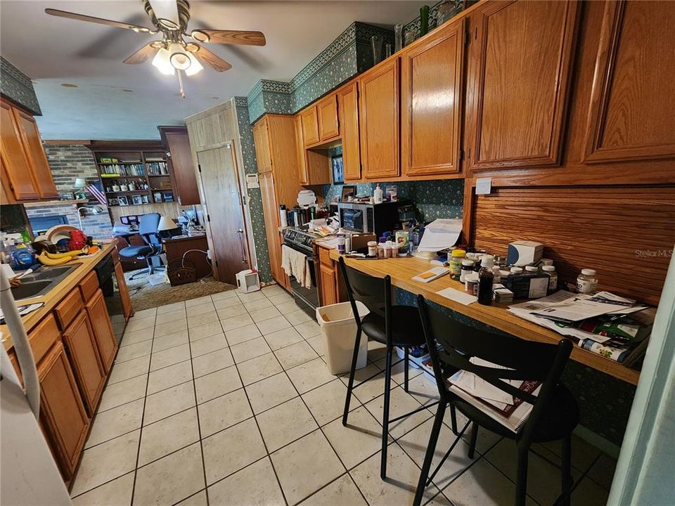 Kitchen towards garage and rear family room.