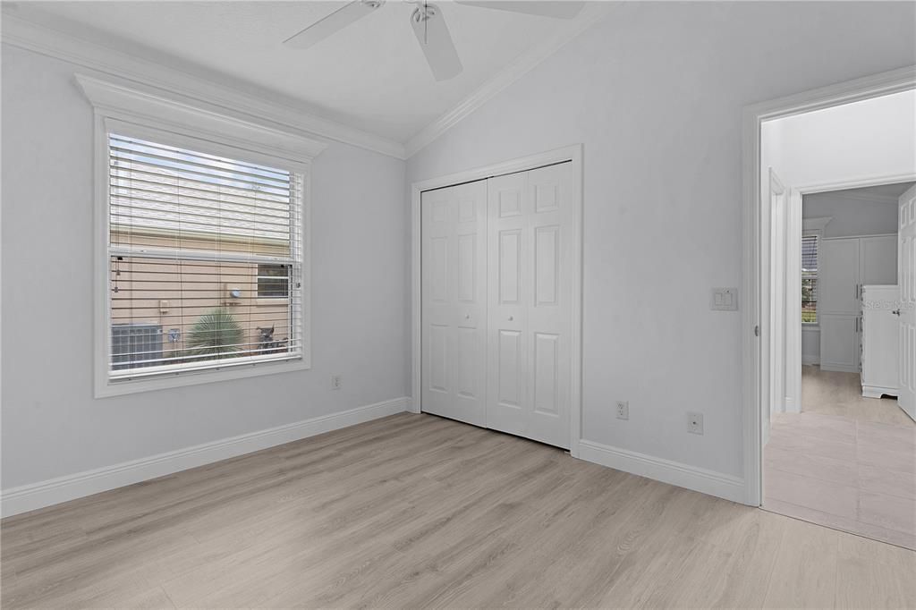 SECOND BEDROOM WITH BUILT IN CLOSET LVP FLOORING