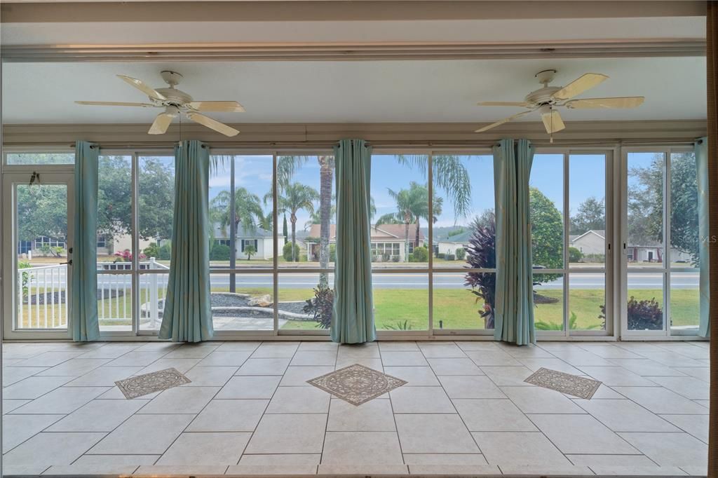 BEAUTIFUL ENCLOSED LANAI WITH CERAMIC TILE AND NO KISSING LANAI'S HERE