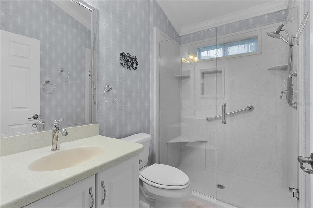 GUEST BATHROOM AREA WITH SHOWER AND HIGH-BOY TOLIET