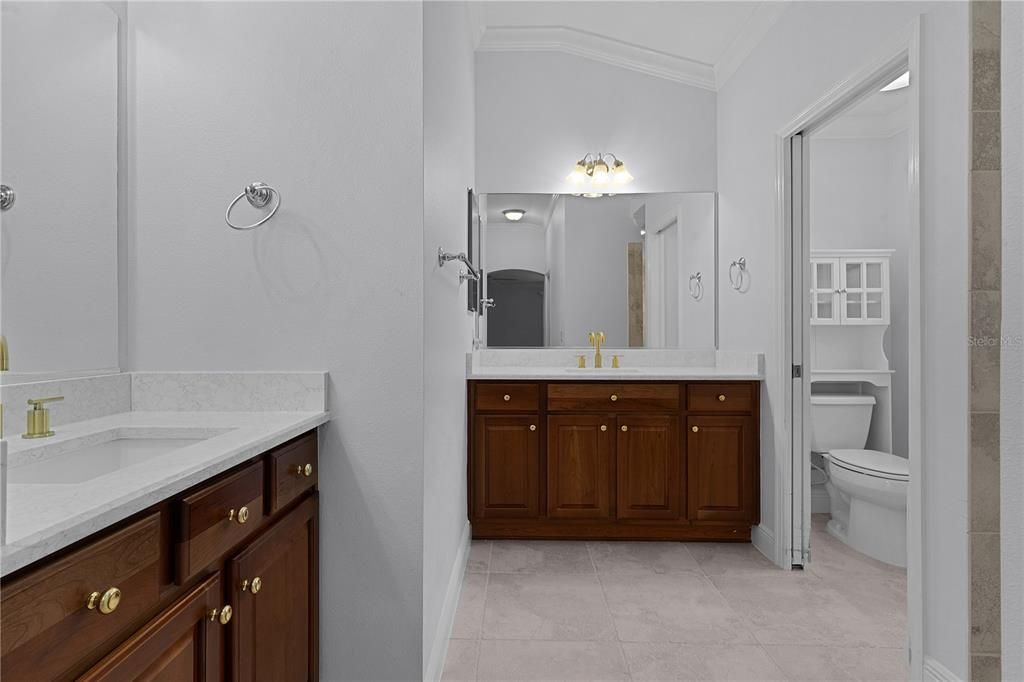 PRIMARY BATHROOM FEATURING FUKK WAKK MIRRORS, ITALIAN FLR TILE AND QUARTZ COUNTERTOPS