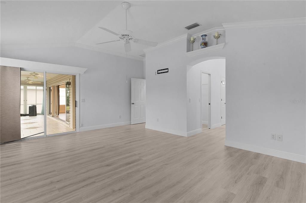 PRIMARY BEDROOM WITH SLIDING PATIO DOOR TO THE LANAI