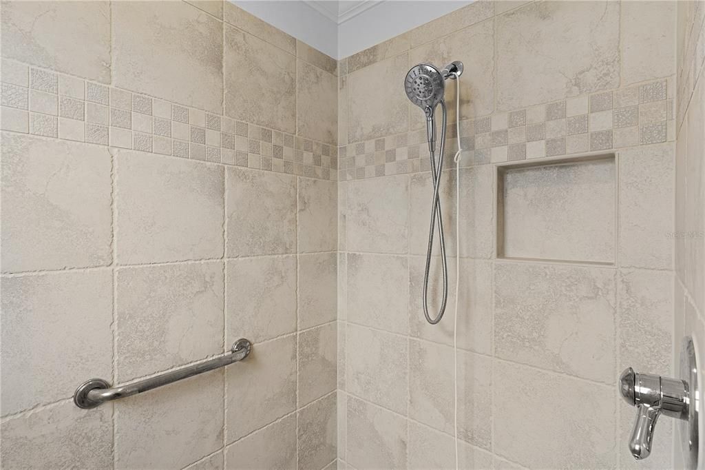 BEAUTIFUL CERAMIC TILED ROMAN SHOWER IN THE PRIMARY BATHROOM