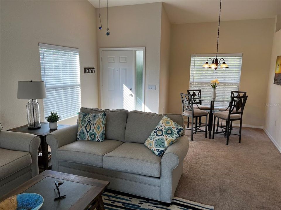 Living Room with view to front door and dining room