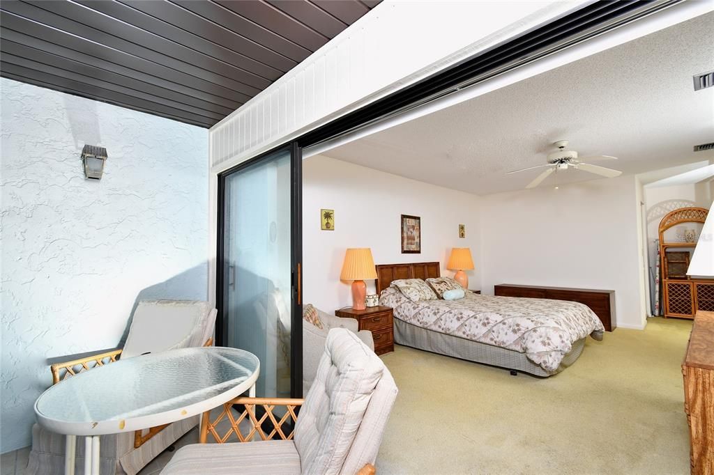 view into primary bedroom from lanai