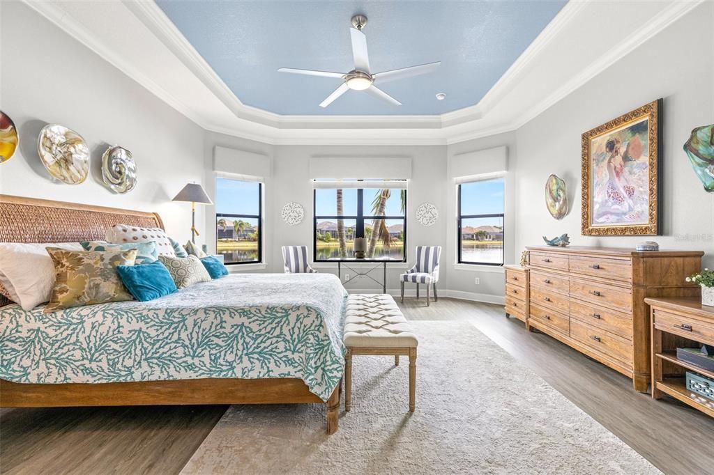 Primary bedroom with bay windows and beautiful water view