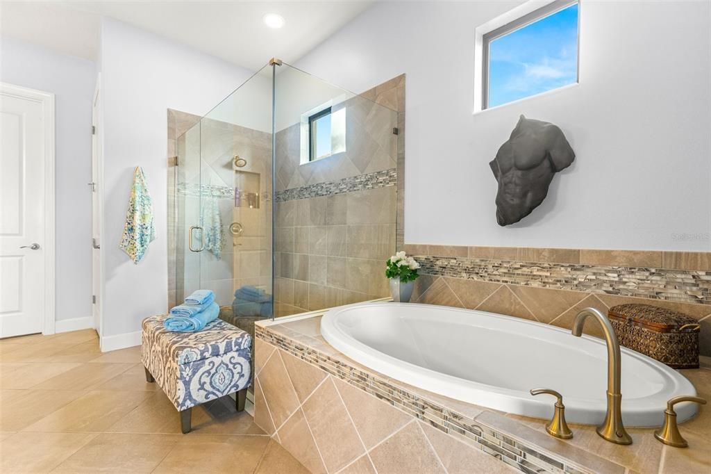 Primary bathroom with oversized soaking tub and walk-in shower