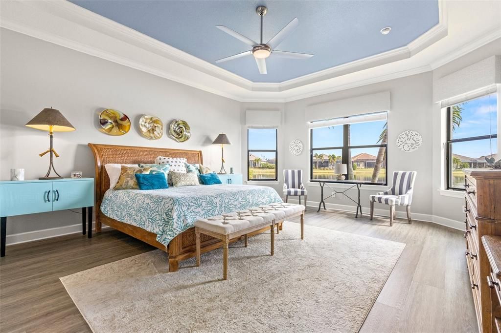 Primary bedroom with bay windows and beautiful water view