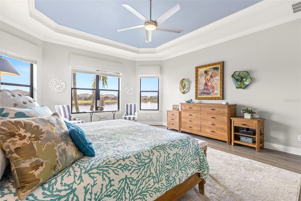 Primary bedroom with bay windows and beautiful water view