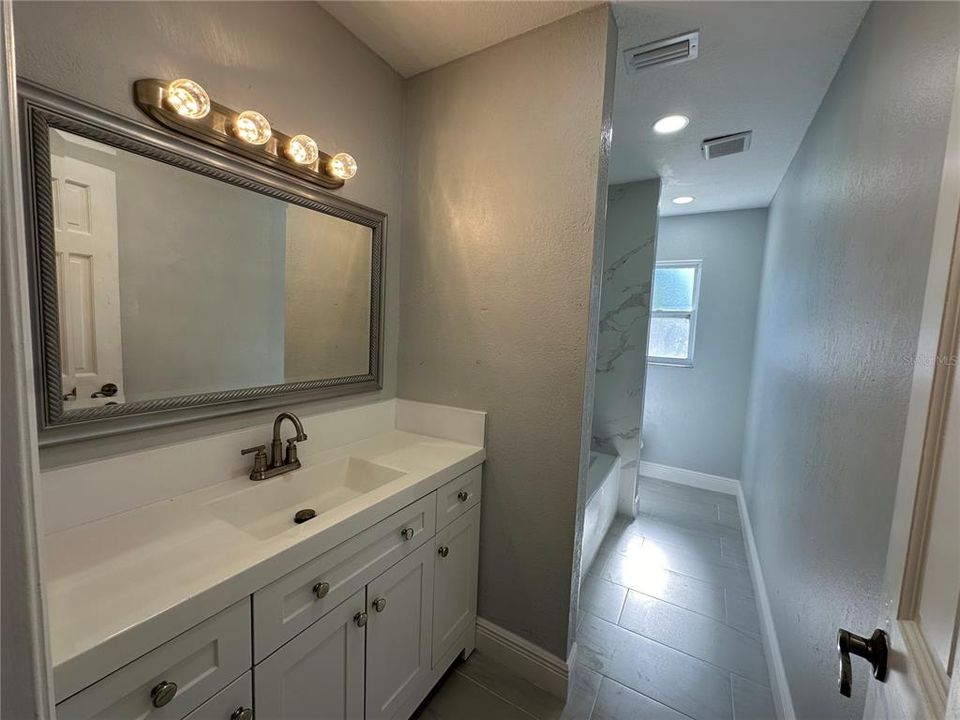 Hallway Bathroom with Tub