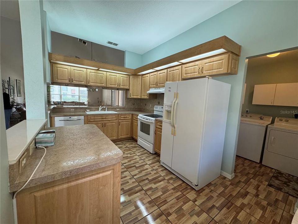 Kitchen with refrigerator, stove, and dishwasher