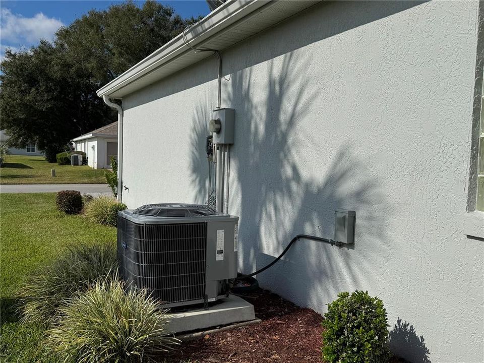 Right side of the house with air conditioner replaced in 2023.