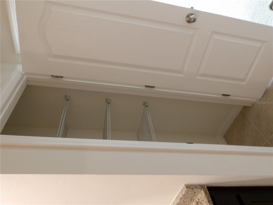 Linen closet in primary bedroom