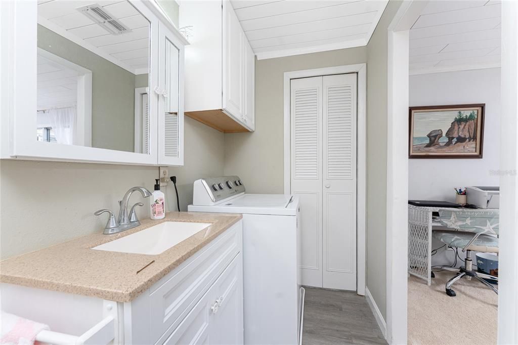 The washer is conveniently located in the master bathroom next to the linen closet.