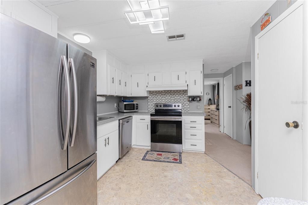 The kitchen has a closet pantry for plenty of storage.