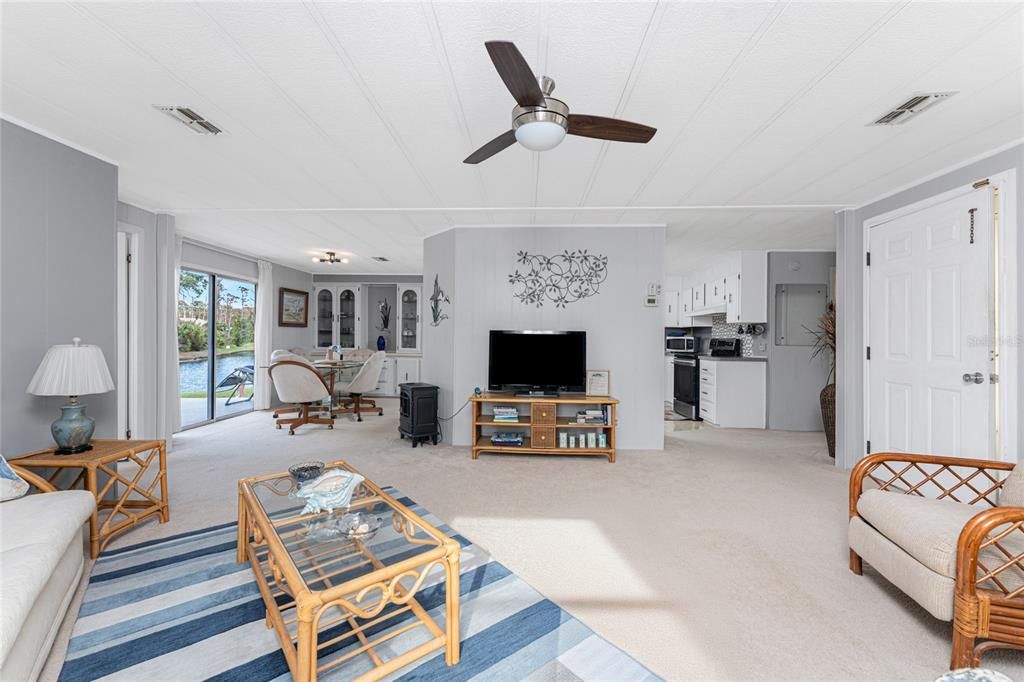 The view from the living room into the dining room and kitchen.