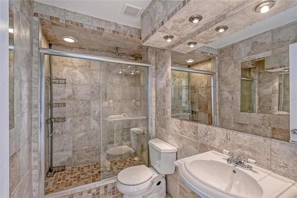 Downstairs full bath with tiled shower.