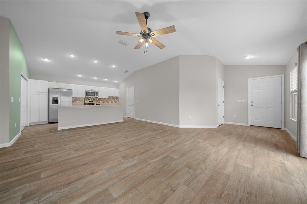 Entry/Living Area with Kitchen in background