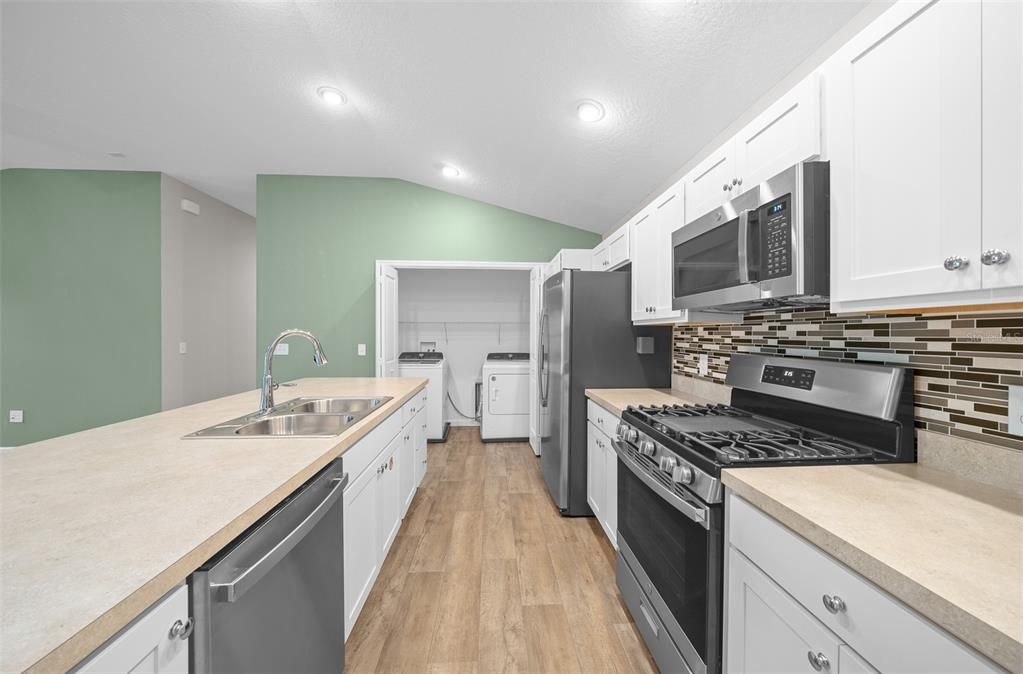 Plenty of counter space and storage! Soft close cabinets with pull out drawers.