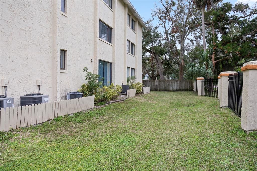 Side patio area by unit