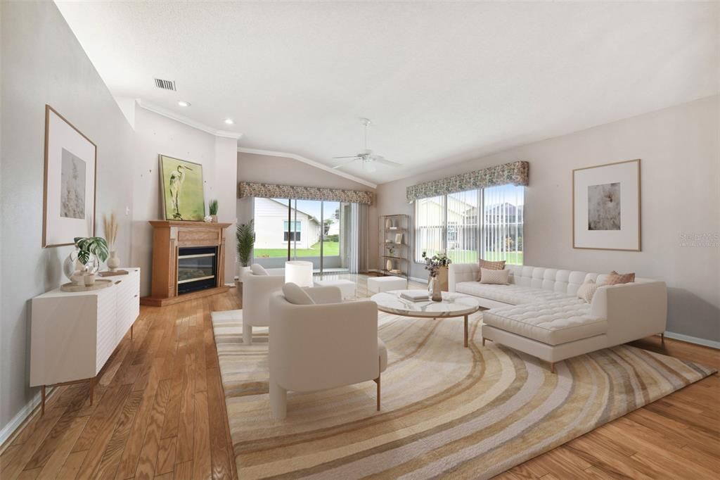 beautifully virtually staged great room with real hardwood floors! High ceilings make this room look grand! All neutral colors