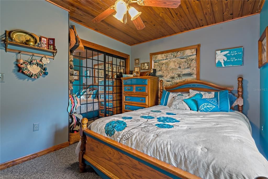 Primary Bedroom with Mirrored sliding doors to Closet.