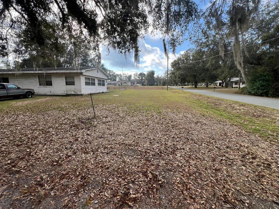 looking south from driveway along front of home down SE 106 Ave