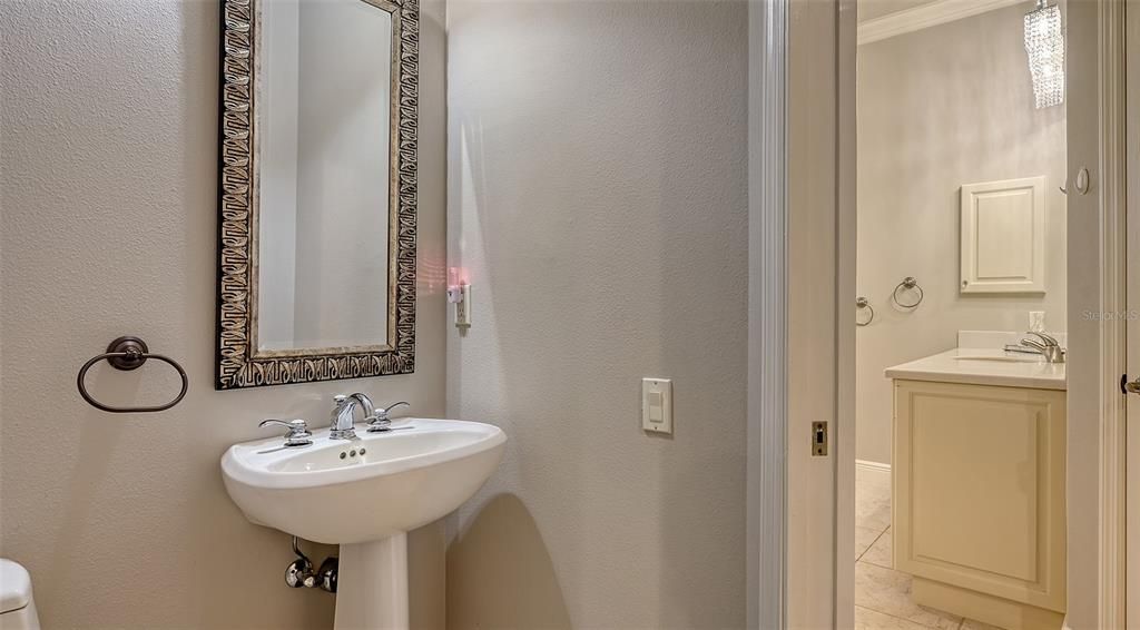 The 2nd floor Spa Bathroom has a private water closet that includes a sink (secondary to the main sink in the shower and bathtub area).