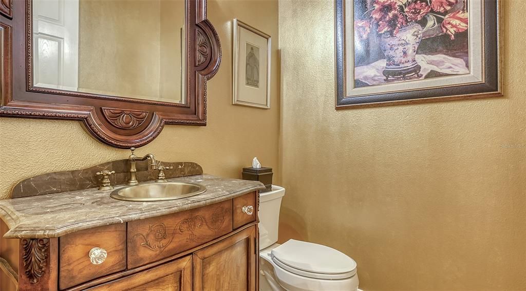 This elegant 1/2 bath is right off the Family Room