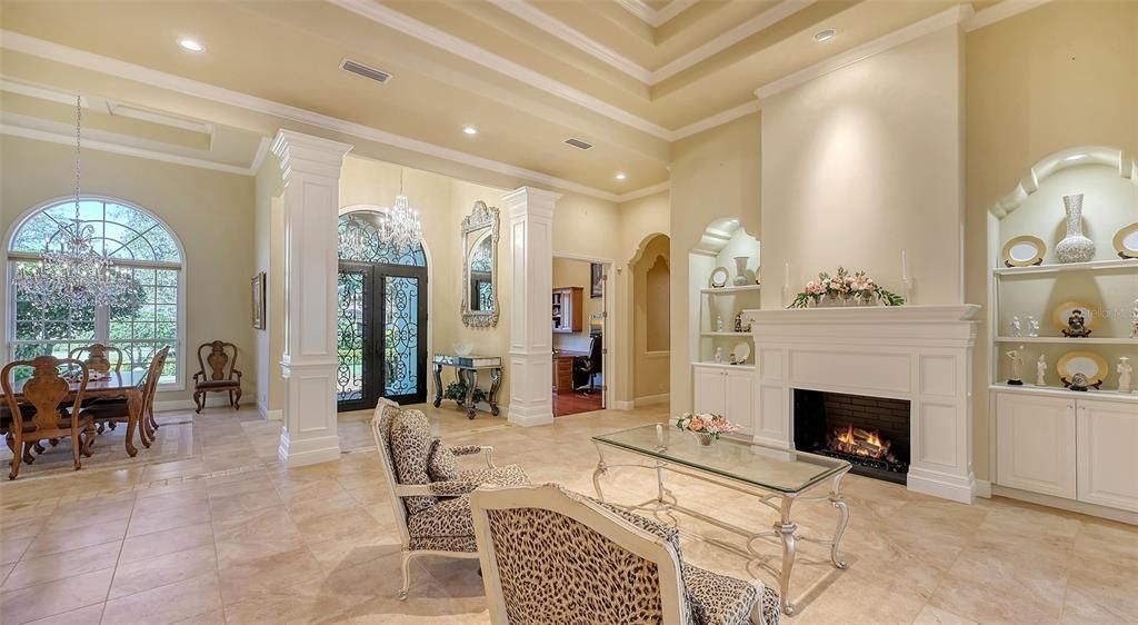 21x21 The Family room features a luxurious fire place and triple crown molding designed to create an impressive elegance