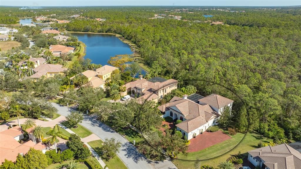 This majestic estate is flanked by an oak hammock