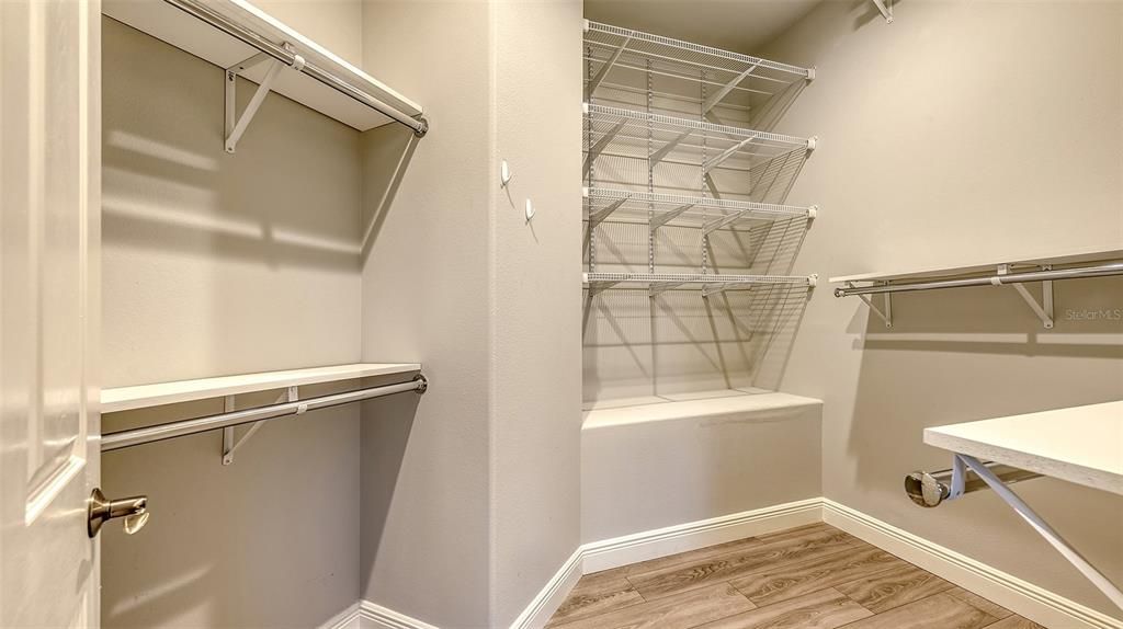 This is a terrific walk-in closet for the 2nd floor Guest/In-law suite- It measures 9x12!