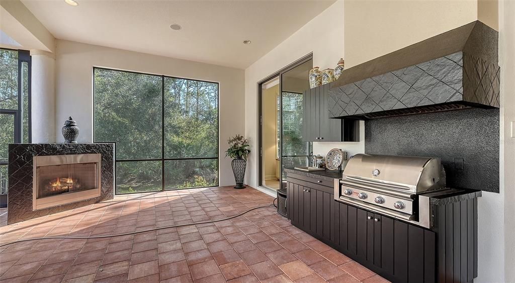 The outdoor entertainment area features a brand new 6 burner grill and delightful fireplace.