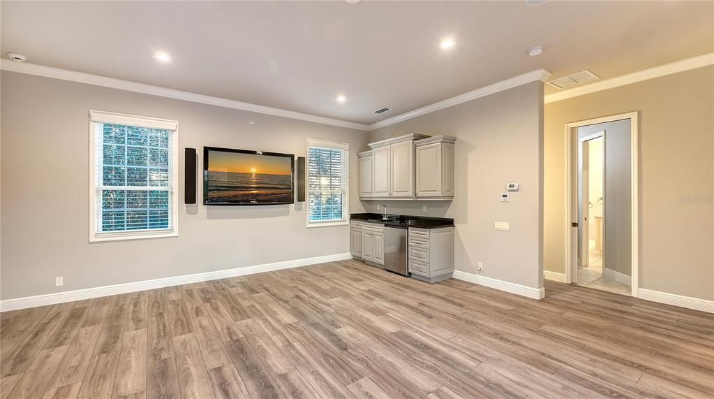 The Bonus Room features a kitchenette that includes a small refrigerator, sink, and good counter space.