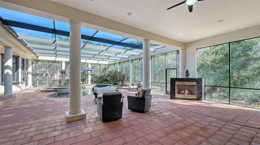 Step outside Bedroom #2 and enjoy this massive lanai, heated pool and spa. as well as a gas burning fireplace.