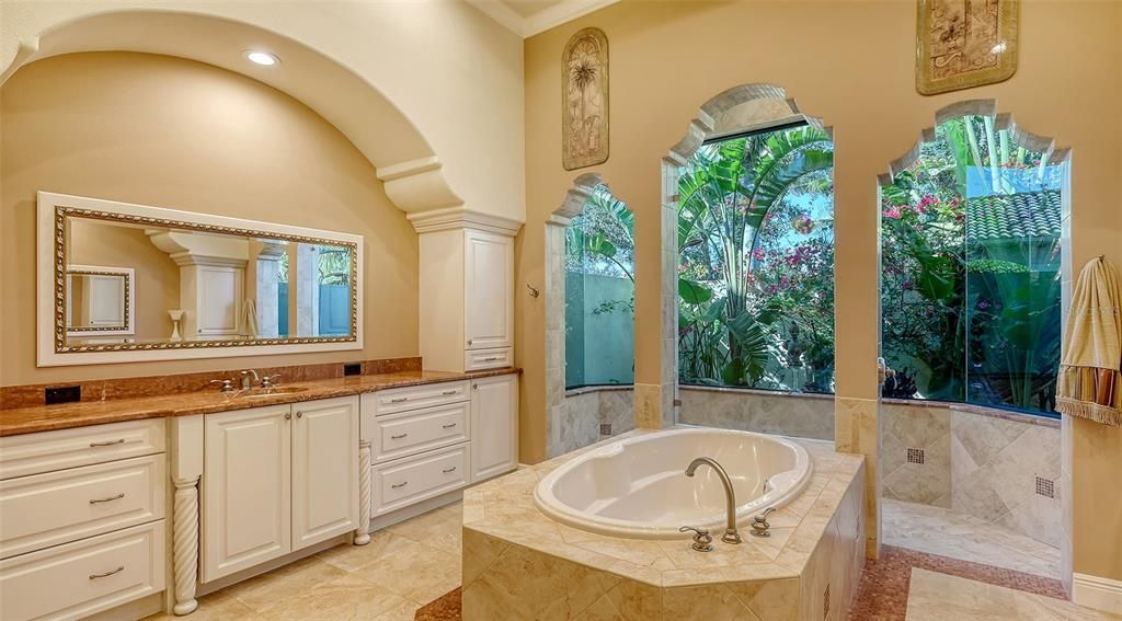 Rich marble countertops, a breathtaking view of your very own private garden....Paradise.