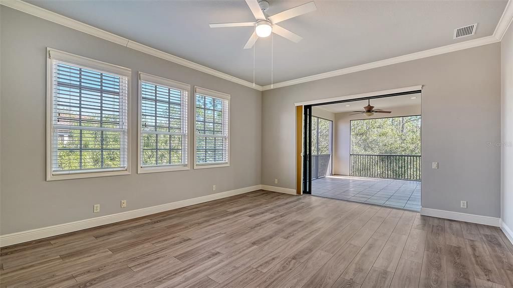 The 4th bedroom features a walk-in closet and disappearing sliders leading to the oversized balcony.