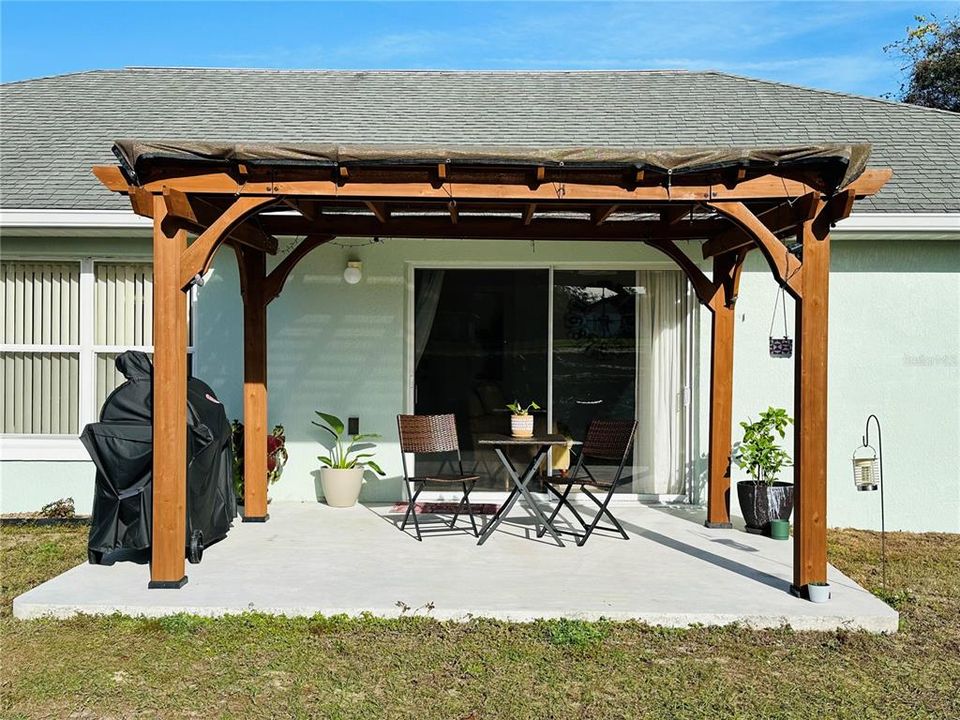 PERGOLA ON PATIO DECK OVERLOOKING GARDEN